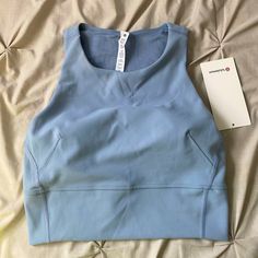 Light Blue/Gray In Color. Cropped Sports Bra. Padding. Nwt. Never Been Worn. Bought Early In Pregnancy And It Doesn’t Fit. Blue Activewear With Light Support For Sports, Blue Racerback Activewear For Light Sports, Light Blue Sporty Tops For Gym, Functional Blue Tops With Light Support, Light Blue Athleisure Activewear For Sports, Blue Tops With Light Support For Gym, Light Blue Breathable Athleisure Activewear, Light Blue Functional Activewear For Gym, Light Blue Sporty Gym Tops