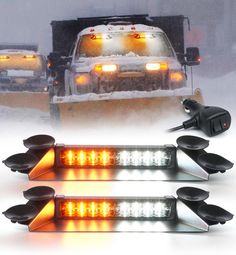 three lights that are on the side of a truck in the snow with two trucks behind them