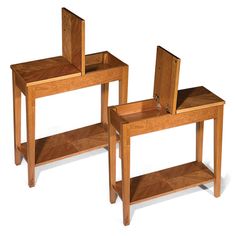 two small wooden tables with mirrors on them