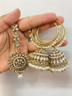 Elevate your style quotient with this gorgeous Mirror hoop earrings set. Made with high-quality materials and crafted with intricate mirror detailing, these mirror jumka hoops are a must-have for any fashion-forward woman who also loves traditional accessories. About this Mirror Hoop Earrings Set - The elegant hoops to fit your everyday attire need - A perfect accessory to wear on any occasion - You can go for these hoop earrings with any ethnic attire - Perfect for jewellery-loving females Dime Wedding Chandbalis For Navratri, Drop Earrings Style, Wedding Chandbalis For Navratri With Drop Shape, Navratri Wedding Drop Danglers Earrings, Round Danglers For Wedding And Navratri, Hand Set Round Hoop Earrings For Wedding, White Chandbali Jhumkas With Hand Set, Festive Tilla Hoop Earrings For Wedding, White Festive Earrings For Wedding, Festive White Earrings For Marriage