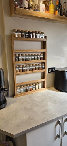 a kitchen counter with spice racks on it