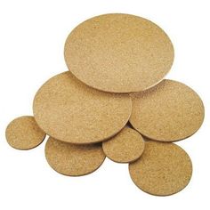 several round cork coasters stacked on top of each other, all in different sizes