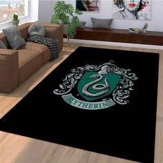 a living room filled with furniture and a harry potter rug