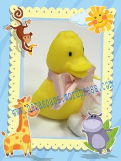 a yellow rubber duck with a pink bow on its head and stuffed animals around it