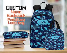 "School Backpack, Travel Bag, Personalized Backpack, Personalized Toddler Backpack, lunchbox, Boys Dinosaur Bag, Girls Backpack, Boys backpack, Backpack with name, Custom girl bag, Named backpack, Children's Bags, Kids Bag, School rucksack, Girls rucksack, Boys rucksack, Pattern backpack, Pencil pouch 💟 Material & Characteristics 1)Design: Designed for kids and children. 2)Features: 👉Made from 1200D high-grade waterproof nylon, durable and fashionable. 👉Two main pockets for carrying books, bi Customizable Blue Standard Backpack, Customizable Blue School Bag, Blue Backpack Gift For End Of School Year, Blue Lunch Bag For Back To School, School Rucksack, Kids' Bag, Toddler Backpack, Boys Backpacks, Personalized Backpack