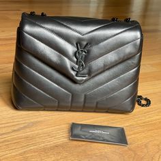 Authentic Saint Laurent Lou Lou Bag Small. Dimensions 6.6"H X 9.8"W X 3.5"D. In Excellent Condition. Comes With Dust Bag And Card. Yves Saint Laurent Bags, Small Shoulder Bag, Small Bags, Yves Saint Laurent, Dust Bag, Saint Laurent, Bag Lady, Shoulder Bag, Black