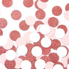 pink and white confetti circles are scattered on the ground, with one circle in the center