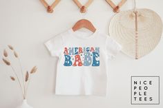 Toddler American Babe Shirt, Kids Fourth of July Shirt, Toddler 4th of July tee, kids USA shirt, Baby Fourth of July shirt, Infant bodysuit BABY & KIDS SHIRTS & BODYSUITS Depending on availability we alternate between the brands Bella + Canvas and Rabbit Skins bodysuits/tees, both have the same fit and are premium quality ► BODYSUIT DETAILS - 5 oz., 100% combed ringspun cotton - 1x1 baby rib - Flatlock stitched seams - Innovative three-snap closure - Double-needle stitched ribbed binding - Easy Patriotic Summer T-shirt With Custom Print, Playful T-shirt For 4th Of July With Crew Neck, Playful Crew Neck T-shirt For 4th Of July, Short Sleeve T-shirt For Gender Reveal In Summer, Cute 4th Of July Birthday T-shirt, Summer Short Sleeve Tops For Gender Reveal, Short Sleeve Tops For Summer Gender Reveal, Playful White T-shirt For 4th Of July, Casual 4th Of July Birthday T-shirt