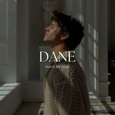 a man standing in front of a window with the words dane on it