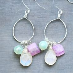 These handmade earrings are a beautiful and unique jewelry gift for any woman, including yourself! Pick the occasion and these beauties will have you covered: weddings, bridesmaids, date night, bachelorette party, or just for a fun pop of color into your daily look.❄️❄️These have all the ice-queen vibes.❄️❄️ Hammered Silver Rainbow Moonstone Lavender Moonstone Mystic Agate  Stunning and elegant. Did you know that when you order jewelry from Daisy and Amused that you also get a reusable, cotton b Handmade Crystal Hoop Earrings For Gift, Sterling Silver Hoop Crystal Earrings For Gift, Moonstone Hoop Earrings Gift, Wire Wrapped Dangle Hoop Earrings As Gift, Hoop Earrings With Natural Stones For Gift, Elegant Hoop Earrings With Natural Stones For Gift, Handmade Moonstone Earrings For Wedding, Elegant Natural Stone Hoop Earrings For Gift, Handmade Moonstone Wedding Earrings