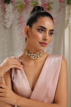 The floral Kundan choker is a celebration of the rich tradition of India that is beautifully handcrafted by the artisans to bejewel your neckline with a belief to balance the ancient and modern concepts of Indian jewelry. The Kundan choker made on 22K gold plating has a replica of Bollywood jewelry, perfect for the women who believe in carrying the light of their heritage. Add this beauty to your jewelry wardrobe and pair it up with a delicate outfit to create a bold look. Necklace Closure - Adj Kundan Temple Necklace For Party, Bollywood Style Necklace For Diwali Party, Temple Jewelry Choker For Diwali Party, Bridal Necklace For Celebration With Cutdana, Festive Temple Jewelry Bridal Necklace For Party, Elegant Choker For Reception And Festivals, Elegant Choker For Receptions And Festivals, Meenakari Choker Necklaces For Parties, Temple Style Meenakari Necklace For Parties