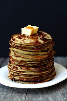 a stack of pancakes with butter on top