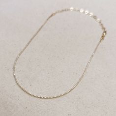 Adorn your neck with this stunning 18k Gold-filled Tennis necklace. Delicate and minimalist, its classic look is sure to make a statement. Our 1.2mm Cubic Zirconia stones shine brightly, making this the perfect accessory for any outfit. Metal: 18k Gold Filled High-quality AAAAA Cubic Zirconia Material: 1.2mm micro CZ chain Size: 12 inches long + 4 inches extender chain Hypoallergenic Water-resistant Handcrafted in Brazil Also available our matching Tennis Bracelet to complete your outfit. Minimalist Diamond Tennis Necklace As Gift, Minimalist Yellow Gold Diamond Necklace With Clavicle Chain, 14k Gold Minimalist Clavicle Diamond Necklace, Minimalist Yellow Gold Diamond Clavicle Necklace, Delicate Cubic Zirconia Diamond Necklace With Delicate Chain, Dainty Cubic Zirconia Diamond Necklace With Delicate Chain, Minimalist Diamond Tennis Necklace, Minimalist Yellow Gold Tennis Necklace Gift, Minimalist White Gold Tennis Necklace Gift