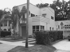 a black and white photo of an apartment building