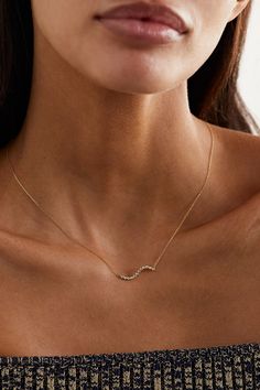 Mateo's necklace is bezel-set with tiny diamonds illustrating a rolling 'wave'. It's handmade from 14-karat gold and has a dainty chain you can adjust between two lengths. Wear yours solo or with another piece from the same ocean-inspired collection. Elegant White Gold Wavy Jewelry, Elegant Wavy White Gold Jewelry, Wavy Yellow Gold Jewelry For Formal Occasions, Formal Yellow Gold Wavy Jewelry, Minimalist Necklace Gold, Wave Necklace, Pearl And Diamond Necklace, Gold Waves, Dainty Gold Necklace