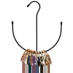 a rack with several pairs of keys hanging from it's hooks on a white background