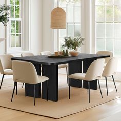 a dining room table with chairs around it