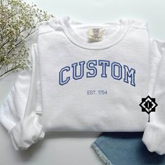 Personalized Custom Embroidered Handmade Sweatshirt, Embroidered Crewneck and Comfort Colors Sweatshirts, Gift for Her, Gift for Him, Wedding and Engagement Gifts Top Chest Center Design: This text will be placed in the top chest area and will measure 8 inches across. Left Chest Design: This text will be placed in the left chest area and will measure 4 inches across. Text Size: Remember, the more text you include, the smaller it will appear in both designs. It's best to keep it short, like a sin White Machine Embroidery Sweatshirt For College, White College Sweatshirt With Machine Embroidery, Classic White Sweatshirt For College, Customizable White Top With Custom Embroidery, Wedding Crewneck, Handmade Sweatshirt, Custom Embroidered Sweatshirt, Chest Design, Longing Quotes