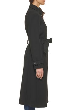 Finish off your cool-weather looks with this polished trench coat fixed with a faux-leather buckle on the finely stitched belt. 45" length Notched lapels Lined 52% wool, 46% polyester, 2% other fibers Dry clean Imported Classic Belted Formal Outerwear, Workwear Outerwear With Belt Loops, Fitted Pea Coat With Belted Cuffs For Fall, Classic Long Coat With Belt, Formal Fall Pea Coat With Belted Cuffs, Classic Belted Outerwear For Work, Formal Fall Outerwear With Belt, Black Belted Outerwear For Formal Occasions, Sleek Belted Fall Outerwear