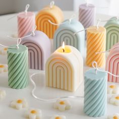 small candles are lined up on a table