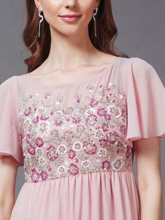 Sizes: To Fit Bust (in inches): XS(30), S(32), M(34), L(36), XL(38) To Fit Waist (in inches): XS(24), S(26), M(28), L(30), XL(32), 2XL(34) Pink embellished embroidered maxi dress Round neck Short, flared sleeve Sequined detail Maxi length in the flared hem Georgette fabric Zip closure Fabric: Georgette Pattern: Embellished Style: Maxi Dress For Women, Indian Dress, Indo-Western Dress, Fusion Outfits Occasion: Party Dispatch within 7 days. Indo Western Dress Party Wear, Fusion Outfits, Georgette Maxi Dress, Ethnic Kurti, Anarkali Lehenga, Maxi Dress For Women, Indo Western Dress, Western Dress, Wedding Jumpsuit