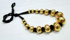 22 K gold Large beads Necklace. Handmade beautiful hollow Gold beads filled with wax inside to give more strength and durability. Good for wear as is or for your own creation. Length-27 cm ( free size easy to adjust the length by pulling the toggle), size of center bead-15/20 MM, Weight-77 grams. Material-22 K gold. Traditional Handmade Gold Kundan Necklace, Handmade Gold Kundan Necklace Bollywood Style, Handmade Gold Temple Necklace For Rituals, Handmade Gold Kundan Necklace For Diwali, Traditional Gold Kundan Necklace With Round Beads, Gold Kundan Necklace With Round Beads For Ceremonial Occasion, Traditional Gold Necklaces For Navratri, Traditional Gold Beaded Necklaces For Ceremonial Occasion, Traditional Gold Beads Necklace For Ceremonial Occasions