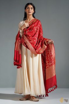 "A timeless dupatta with a mantra handwoven in elegant golden zari. Raw and beautiful - so appealing in its textured appearance and perfect in its imperfections!\n\n\n\n Color\u00a0- A beautiful shade of Maroon with the textured appeal of natural fabric.\n\n\n Technique\u00a0- Classic handwoven Banarasi art passed down through generations\n\n Fabric\u00a0- Textured in appearance, pure Dupion silk\n\n\n Speciality\u00a0- An unusual script pattern, chic and traditional at the same time.\n\n Tilfi Banaras Dupatta, Shades Of Maroon, Dupion Silk, Katan Silk, Natural Fabric, Fashion Attire, Indian Fashion Dresses, Natural Fabrics, Indian Dresses