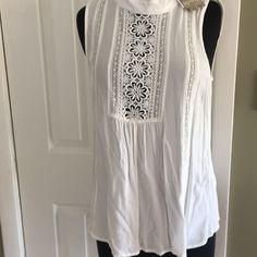 Size M Nwt White Embroidered Half Way In Front Of Shirt Back Has A Small Round Opening That Buttons Wear Casual Or Dressy 100% Rayon Casual Tank Top With Lace Detail, Casual White Tank Top With Floral Embroidery, Summer Sleeveless Tops With Floral Embroidery, Sleeveless Tops With Floral Embroidery For Day Out, Floral Embroidery Sleeveless Top For Day Out, White Sleeveless Tops For Spring, Floral Embroidered Sleeveless Top For Day Out, Cotton Lace Top Tank Top, Casual White Lace Tank Top