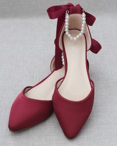 "Satin pointy toe flats with beautiful row of pearls as ankle strap. Comfortable throughout your special day and perfect for holiday party, night out and wedding party. YOU CAN CHOOSE THE PEARLS ANKLE STRAP AT CHECKOUT Details: COLORS AVAILABLE: Black, Blush, Burgundy, Champagne, Light Blue, Navy, Red, Royal Blue, Ivory, and White UPPER: Synthetic upper and lining MATERIALS: Mandmade outsole STYLE NAME: BELLA SIZE FIT: RUNS LARGE, ORDER HALF SIZE DOWN FROM YOUR NORMAL SIZE Not sure of which size Fall Wedding Shoes, Burgundy Flats, Dark Red Dresses, Bridal Flats, Velvet Flats, Wedding Flats, Pointy Toe Flats, Bridesmaid Shoes, Evening Shoes