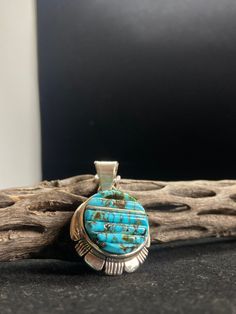 Southwestern Sterling Silver Necklaces With Round Pendant, Southwestern Sterling Silver Necklace With Round Pendant, Unique Polished Turquoise Necklace, Artisan Polished Round Pendant Necklace, Untreated Sterling Silver Round Pendant, Artisan Necklace With Polished Round Pendant, Turquoise Engraved Amulet Jewelry, Engraved Turquoise Amulet Jewelry, Artisan Round Pendant Necklace With Polished Finish