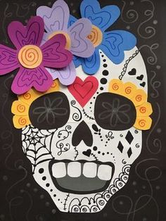 a paper skull with colorful flowers on it's head is shown in front of a black background