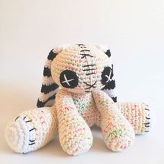 a crocheted stuffed animal sitting on top of a white table