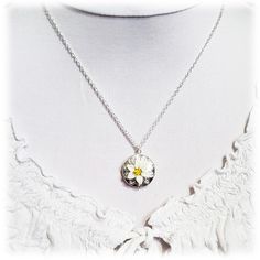 "Handcrafted Easter Lily Locket Necklace featuring hand sculpted white flower and a filigree backdrop on a shiny silver tone locket. -Locket : 2cm (approx. 3/4 inch) silver-plated locket -Interior Locket (for photo) : 13mm (1/2 inch) -Cable Chain : Choose silver plated or upgrade to 925 sterling silver -Length : Choose 16\" or 18\" cable chain View matching collection at: https://www.etsy.com/shop/strandedtreasures/search?search_query=easter+lily Flowers are hand sculpted without molds or paint Flower-shaped Engraved Jewelry Gift For Her, Flower-shaped Engraved Jewelry As Gift For Her, Flower Shaped Engraved Jewelry Gift For Her, Engraved Flower Jewelry As Gift For Her, Delicate Silver Flower Charm Necklace, Dainty Silver Locket Jewelry, Dainty Silver Flower Charm Necklace, Dainty Silver Locket Necklace With Round Pendant, Silver Delicate Flower Charm Necklace