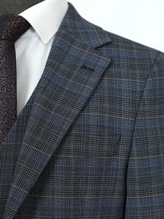 Men's suits are the ultimate in formal wear, designed to make a statement of sophistication and style. Whether you prefer a classic or slim fit, a tailored or bespoke suit, there's a perfect suit for every occasion. With single-breasted or double-breasted styles, notch or peak lapels, and solid colors or checkered and herringbone patterns, you can create a suit that's uniquely yours. For the most formal occasions, a tuxedo or dinner jacket will make you stand out from the crowd. And for a three- Luxury Fitted Three-piece Suit For Business Casual, Luxury Business Sport Coat Tailored Fit, Business Casual Custom Fit Suits, Luxury Custom Fit Sport Coat For Business, Luxury Fitted Sport Coat In Suiting Fabric, Custom Fit Double Breasted Suit For Business, Luxury Slim Fit Three-piece Suit For Business, Luxury Single-breasted Custom Fit Suits, Fitted Dapper Business Suit