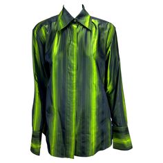 TheRealList presents: an electric green iridescent Gucci silk button-up shirt, designed by Tom Ford. From the Fall/Winter 1997 collection, this top was featured on the season's runway in multiple color variations and is one of Ford's more notable pieces during his early tenure at Gucci. This stunning top is constructed of iridescent silk with vertical stripes which glisten with every movement. Featuring a collar, button closure, exaggerated cone cuffs, and built-in shoulder pads, this shirt is a Gucci Formal Collared Shirt, Gucci Classic Formal Shirt, Gucci Blouse, Tom Ford Runway, Shoulder Pad Top, Gucci Menswear, Tom Ford Gucci, Electric Green, Stunning Tops