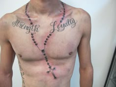 a shirtless man wearing a rosary with the words strength, love and laughter written on his chest