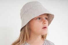 Children's summer hat. Reversible model made from upcycled, natural  linen.  Linen fabric is not only soft, but has also temperature-regulating qualities that will keep your children's head cool and dry even on the warmest days of summer. It is a breathable fabric. Bucket hat design with the possibility of turning the brim over. The upcycling technique gives second-hand fabrics a new life. As a result of this process, as well as following the zero waste principle, we have created this children's summer hat. It not only has a higher value than the processed raw materials, but also a better value for the environment. Composition 100% upcycled linen Handmade in Poland. Adjustable Natural Color Bucket Hat For Everyday, Casual Natural Linen Hat, Linen Summer Hat For Outdoor, Summer Linen Hat For Outdoor, Adjustable Linen Bucket Hat For Summer, Adjustable Casual Linen Hats, Summer Linen Bucket Hat, Casual Linen Spring Hat, Casual Beige Linen Hat