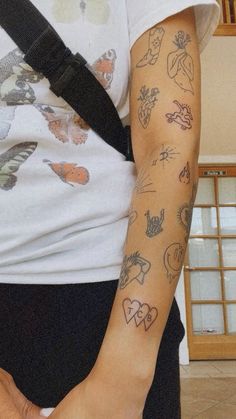 a person with tattoos on their arm and shoulder