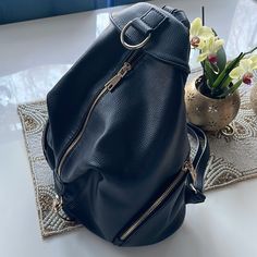 Never Used Casual Black Backpack With Detachable Strap, Casual Black Leather Backpack With Detachable Strap, Chic Black Backpack For Daily Use, Casual Black Leather Crossbody Backpack, Chic Black Standard Backpack, Chic Black Crossbody Backpack, Chic Black Backpack With Zipper Pocket, Chic Black Backpack With Detachable Strap, Leather Backpack