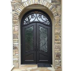 a black double door with intricate iron work on the front and side doors are shown