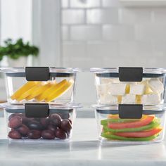 three plastic containers filled with different types of food