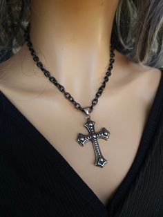 This is a blackened steel Gothic cross Necklace great alone or layered with others. Choose one or both!  The minimalist design gives it a trendy and stylish feel, while the black steel gives it a touch of goth Punk edge. it is all hypoallergenic stainless steel. The round bead choker necklace runs from 14 to 16 inches with a built-in extender.  The cross necklace runs from 16 to 18 inches with built-in extender. Punk Style Metal Cross Jewelry, Handmade Punk Style Cross Jewelry, Edgy Metal Cross Jewelry, Gothic Black Metal Cross Necklace, Edgy Cross-shaped Metal Jewelry, Handmade Black Stainless Steel Necklace, Gothic Black Cross Necklace Gift, Gothic Oxidized Stainless Steel Necklaces, Black Gothic Jewelry With Oxidized Finish