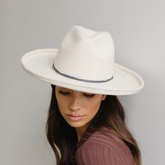 A hat band that is simple but stylish, the double strand rope band is the perfect minimal touch to take your hat style to the next level. This band is available in 55 XS, 57 S/M, 59 M/L and 61 XL to fit your corresponding hat. Material - Waxed cotton Simply slide the band over the top of the crown of your hat to the point the crown touches the brim and then pull tails of band to tighten. Vineyard Wedding Venue, Gigi Pip, Halo Style, Hat Style, Wearing A Hat, Find Color, Black Feathers, Vineyard Wedding, Felt Hat