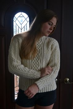 Absolutely stunning cable sweater in 100% wool. Made to order in your size, so please allow 4-8 weeks for the item to be hand knitted! Since it is 100% wool, it is a bit itchy, so please be aware of that when ordering.  Contact me for an acrylic option if you are allergic to wool!   Contact me if you need the sweater sooner than 4-8 weeks - we can knit it quickly for an additional fee.  Women's S: Finished Chest 40", Length 24 1/2" Women's M: Finished Chest 44", Length 25" Women's L: Finished Chest 48", Length 25"  Compare to a sweater that you like the fit of. Pictures show a size small sweater on a 38" chest, model is 5'8". Cozy Fitted Cable Knit Sweater, Fitted Classic Chunky Knit Sweater, Cozy Fitted Wool Knitting Pattern, Fitted Hand Knitted Merino Wool Sweater, Fitted Wool Knitting Pattern, Hand Knitted, Classic Fitted Fair Isle Sweater, Wool Cable Knit Long Sleeve Pattern, Winter Fitted Cable Knit Pattern, Cozy Wool Cable Knit Pattern