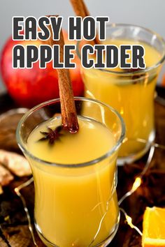 Two small glasses with homemade hot apple cider.