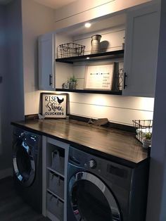 a washer and dryer in a room with shelves above the washer's door