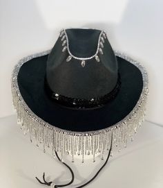 Custom rhinestone strass tassel fringe cowboy / cowgirl felt hat. Choose from Black or White base hat. Next choose Gold, Rose Gold, Silver, Silver AB Teardrop or Silver Teardrop trim. Trim color choice will correspond to rhinestone detail on crown, I.e Gold trim choice will have matching Gold rhinestone detail at the top of hat. A coordinating sequin hatband completes this ultra glam cowboy hat. Perfect for festivals, birthdays, bachelorette, or costume parties..I also offer completely custom or Western Hats With Bling For Rodeo, Western Bling Hat For Rodeo, Western Style Bling Hats For Rodeo, Western Style Adjustable Hat With Rhinestone Fringe, Western Wide Brim Hat With Bling, Western Party Hat With Rhinestone Fringe, Adjustable Festival Hats With Rhinestone Fringe, Adjustable Rhinestone Fringe Hat For Festivals, Western Hat Bands With Rhinestones For Rodeo