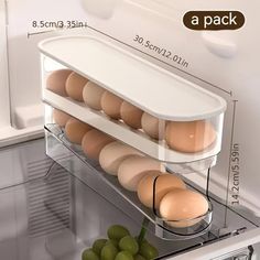 an open refrigerator with eggs in it and labeled on the bottom shelf, as well as instructions for how to pack them