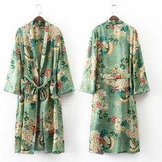 Relax in luxury in our gorgeous Long Floral Kimono Cardigan. This beautiful piece features an Eastern-inspired floral design, decadent spun silk material, and a long, loose fit that’s perfect to lounge in. Pair this piece with the matching lounge pants and one of our cozy t-shirts for maximum stay-at-home comfort and style. Spring Floral Print Outerwear For Loungewear, Summer Long Sleeve Kimono For Daywear, Long Sleeve Summer Kimono For Daywear, Fitted Printed Summer Outerwear, Fitted Summer Outerwear With Prints, Spring Floral Print Fitted Kimono, Spring Silk Kimono For Loungewear, Spring Long Sleeve Fitted Kimono, Chic Green Long Sleeve Kimono