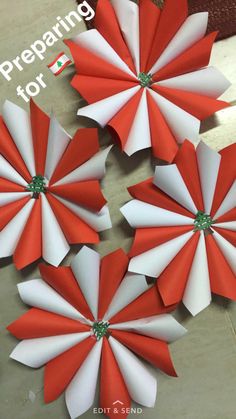 four red and white paper flowers with the words preparing for